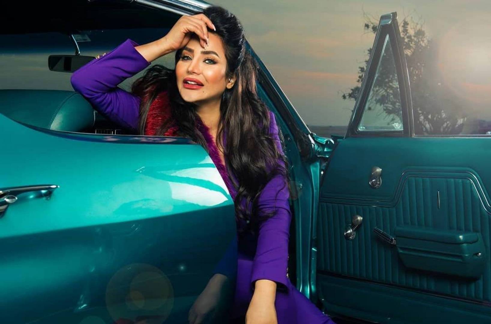 Lojain Omran posted a photo on her Instagram social media account while she was signing some papers with a real estate professional.
